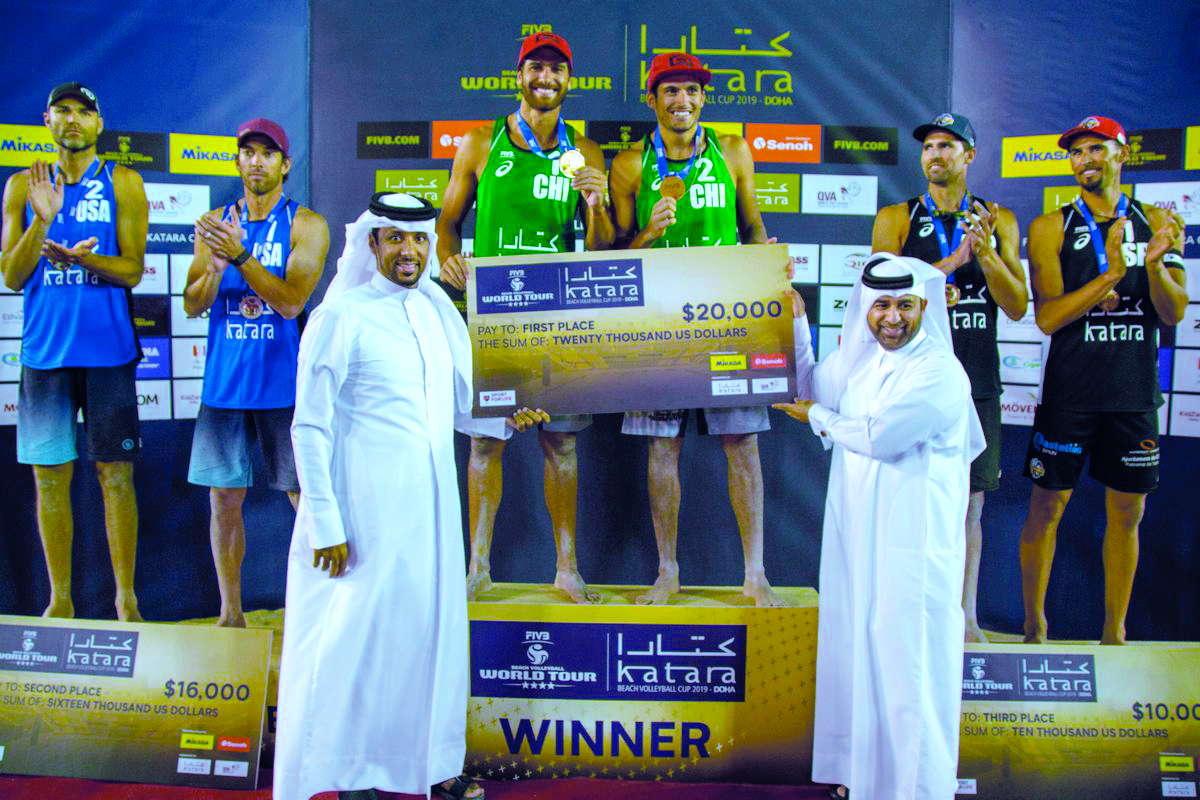 Marco (left) and Esteban Grimalt celebrate on the podium after winning the FIVB Beach Volleyball World Tour Katara Cup in Doha, yesterday.
