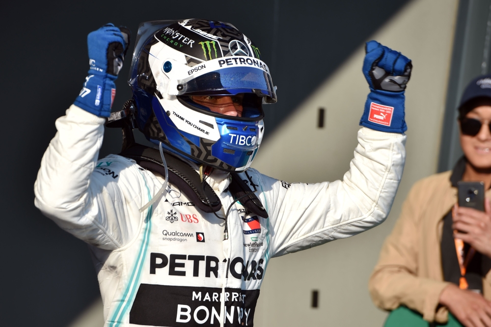 Mercedes' Finnish driver Valtteri Bottas celebrates winning the Formula One Australian Grand Prix in Melbourne in Melbourne on March 17, 2019.  AFP / Peter PARKS 