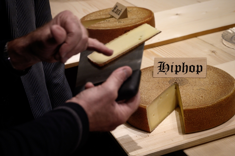 This picture taken on March 14, 2019 shows a round of cheese that has been matured for 6 month with hip hop music, on the final day of an experiment conducted by the University of the Arts in Berthoud, in the Emmental region, central Switzerland.  AFP / F
