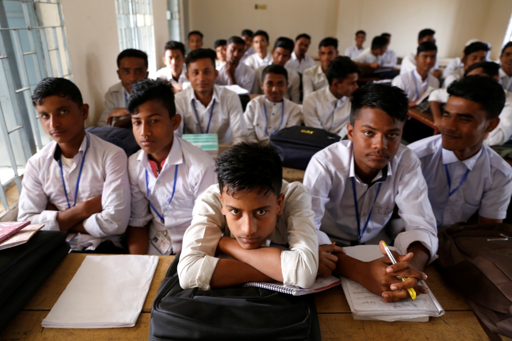 File photo of Rohingya students are seen during a class at school, at Leda refugee camp in Cox’s Bazar, Bangladesh, February 9, 2019. Picture taken February 9, 2019. REUTERS/Jiraporn Kuhakan