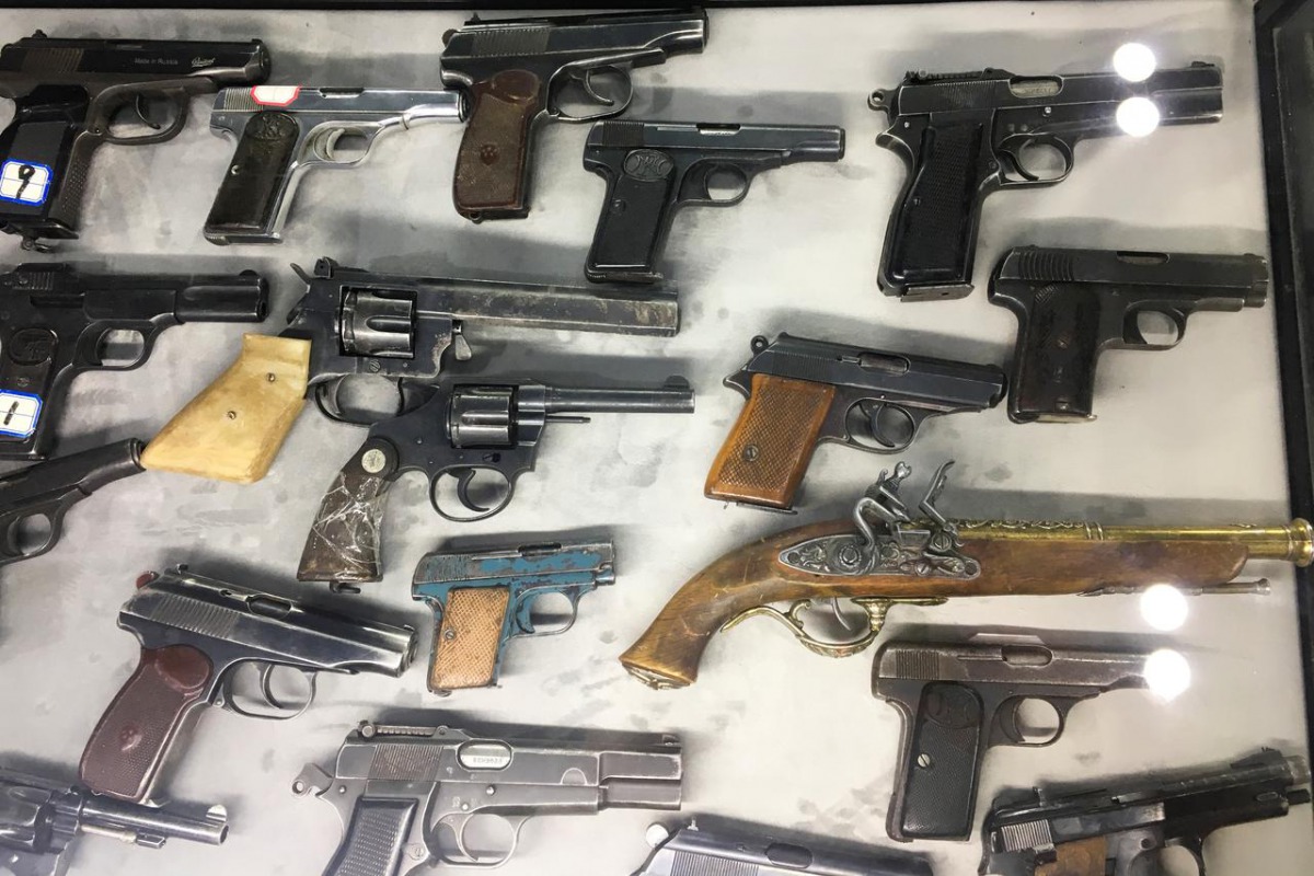 File photo of weapons the government says were seized from militants in Xinjiang are on display at an exhibition titled 