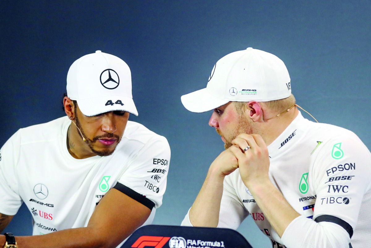 Mercedes' Finnish driver Valtteri Bottas (R) and second-placed Mercedes' British driver Lewis Hamilton attend a press conference after the Formula One Australian Grand Prix in Melbourne on March 17, 2019. AFP / Asanka Brendon Ratnayake