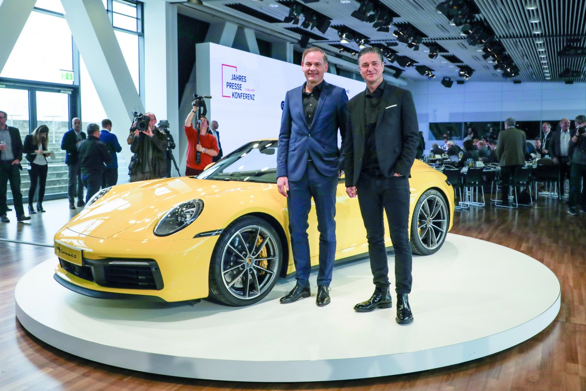 Senior officials of Porsche AG posing with the latest model.