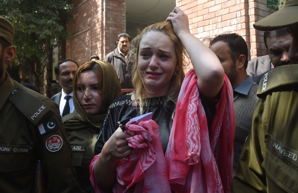Czech model Tereza Hluskova weeps after the court decision to sentence her to eight years and eight months in prison for attempted heroin smuggling, in Lahore on March 20, 2019.  AFP / ARIF ALI