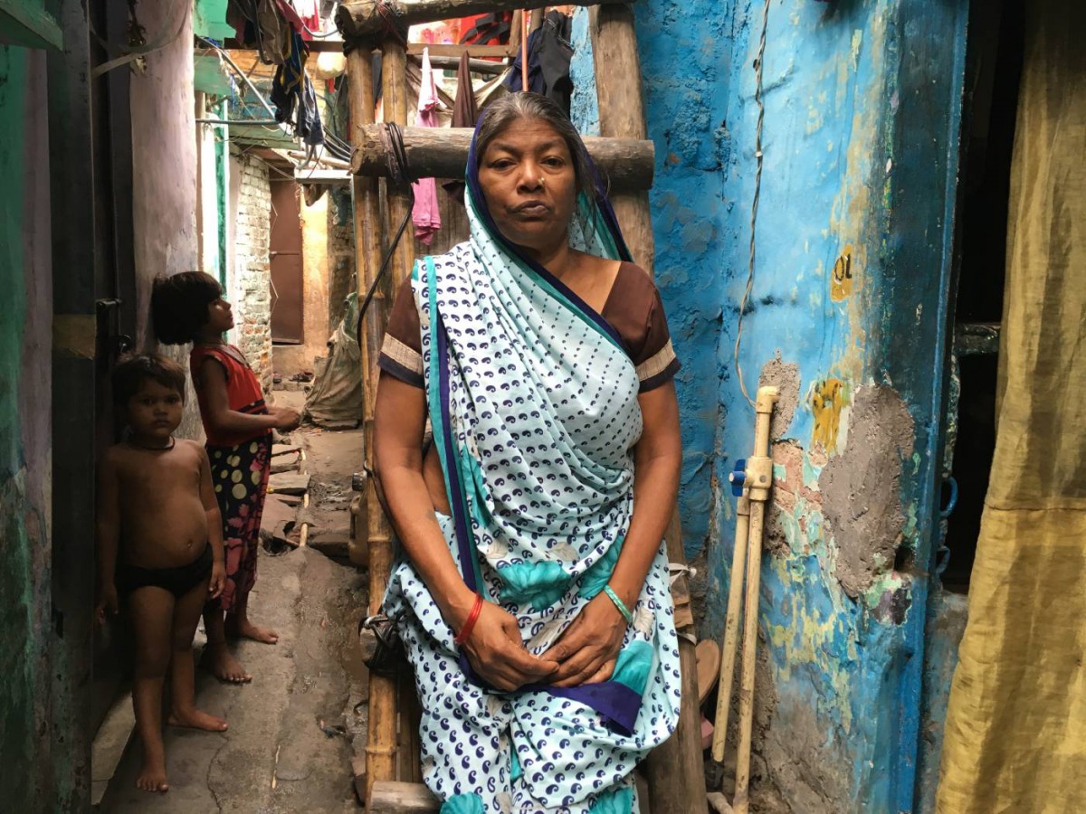 Sushila Devi, who lost her son and husband in a water dispute, poses for a photo outside her one-room shanty in Delhi, India, June 26, 2018. Thomson Reuters Foundation/Annie Banerji