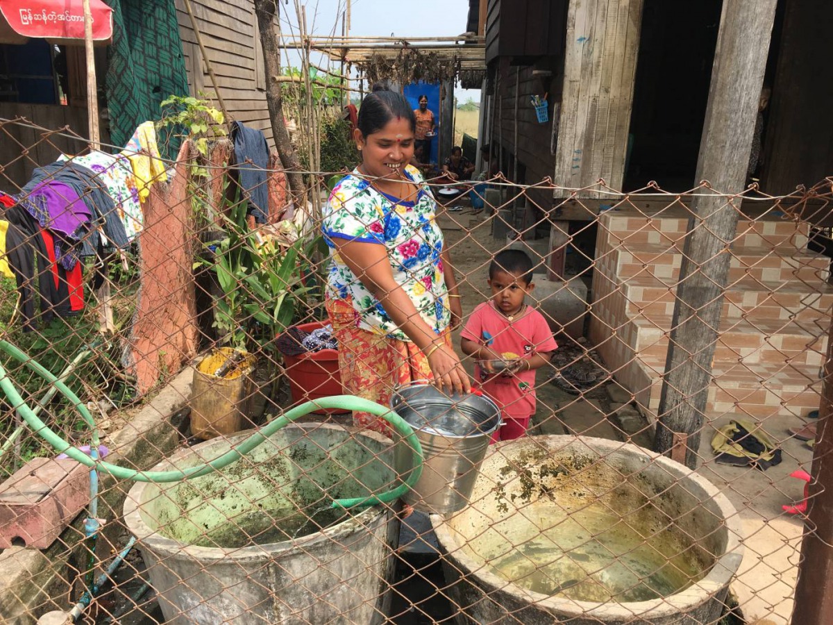 Residents fetch water in Myaing Thar Yar village, who were relocated for the Thilawa Special Economic Zone, about 23 km (9.3 sq miles) southeast of Yangon, Myanmar, February 12, 2019. Thomson Reuters Foundation/Rina Chandran