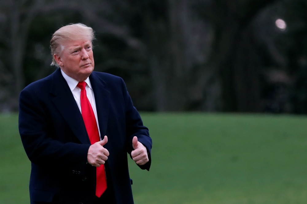 US President Donald Trump reacts as he returns to the White House after U.S. Attorney General William Barr reported to congressional leaders on the submission of the report of Special Counsel Robert Mueller in Washington, U.S., March 24, 2019. REUTERS/Car