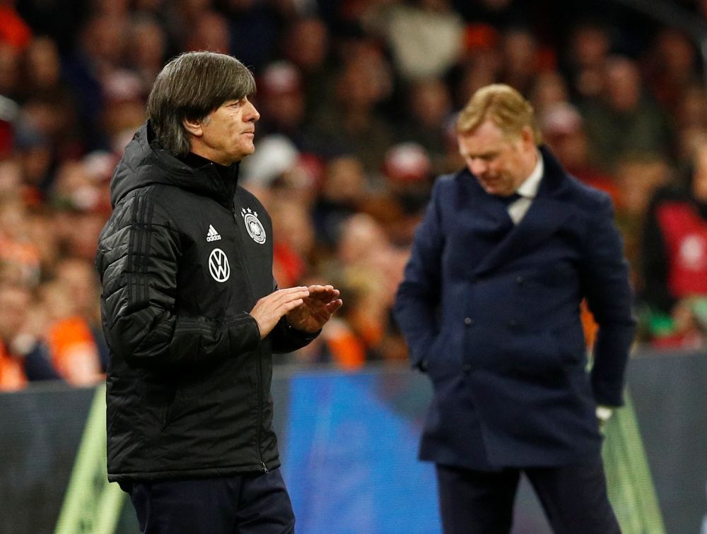 Germany coach Joachim Loew and Netherlands coach Ronald Koeman during the match REUTERS/Francois Lenoir
