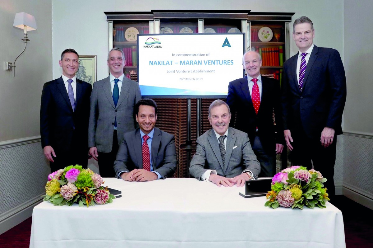 Nakilat’s Chief Executive Officer Abdullah Al Sulaiti (left), Maran Ventures Chairman John Angelicoussis; and other officials during the signing ceremony.