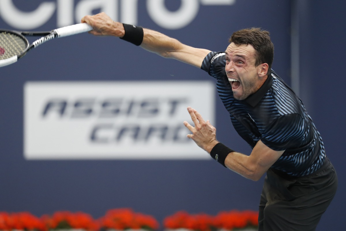 Roberto Bautista Agut of Spain serves against Novak Djokovic of Serbia (not pictured) in the fourth round of the Miami Open at Miami Open Tennis Complex. Credit: Geoff Burke-USA TODAY Sports
