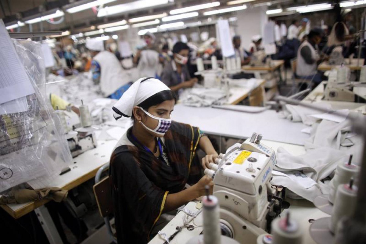  A woman works at a garment factory inside the Dhaka Export Processing Zone (DEPZ) in Savar April 11, 2013. Reuters/Andrew Biraj