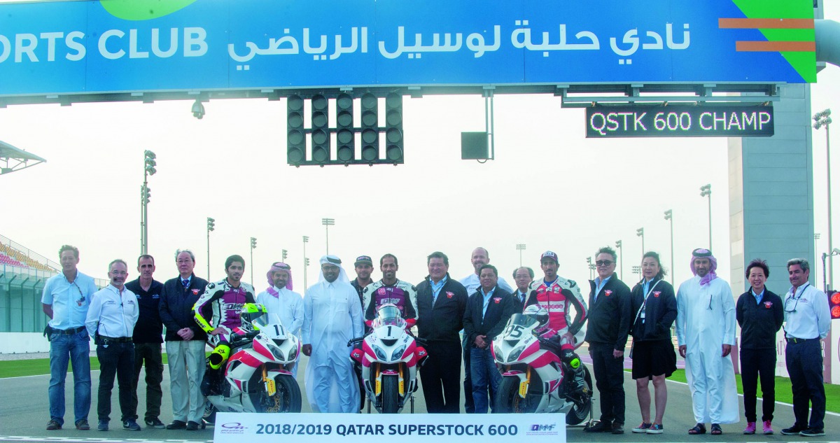 Top three riders of the QSTK600 Championship, Saeed Al Sulaiti, Abdulla Al Qubaisi and Mashel Al Naimi pose for a photograph with FIM ASIA President Stephan Carapiet, Deputy President Stan Yasuhiro, Qatar Motor and Motorcycle Federation President Abdulrah