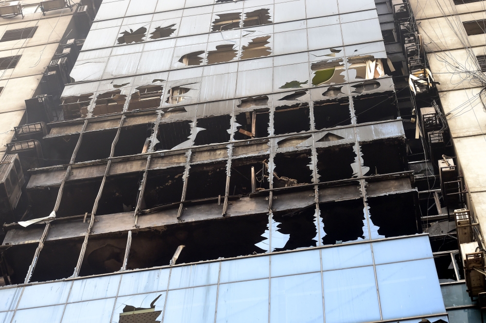 Wreckage of the burnt building is seen in Dhaka on March 29, 2019, a day after flames tore through the 22-storey FR Tower. AFP / MUNIR UZ ZAMAN