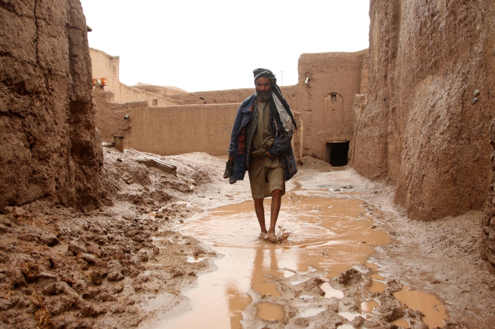  An Afghani man walks at a flooded area due to heavy rainfall in Herat, Afghanistan on March 30, 2019. At least 15people lost their lives after flood.  Mir Ahmad Firooz - Anadolu