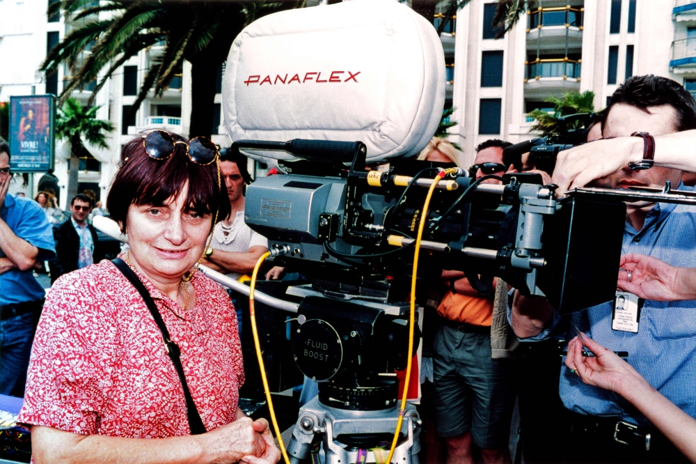 French director Agnes Varda gives instructions to actors next to a camera in Cannes during the shooting of her next movie 