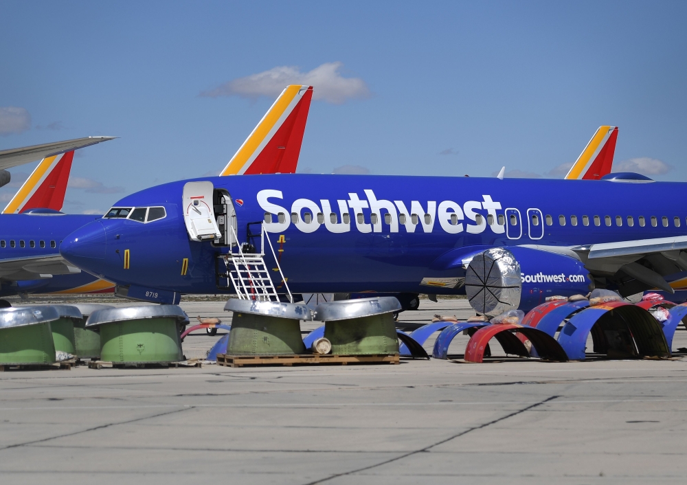 Southwest Airlines Boeing 737 MAX aircraft are parked on the tarmac after being grounded, at the Southern California Logistics Airport in Victorville, California on March 28, 2019. AFP/Mark Ralston 
