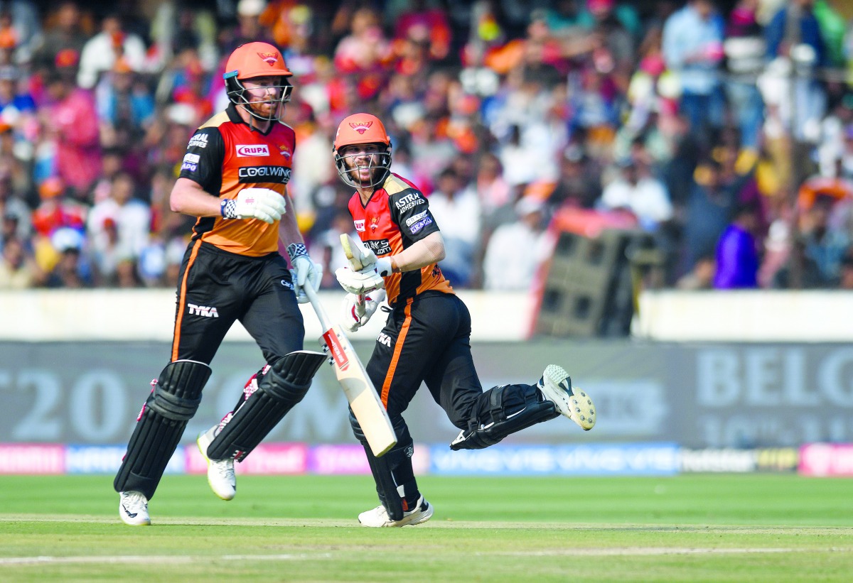 Sunrisers Hyderabad’s Jonny Bairstow (left) and his team-mate David Warner run between the wickets during the IPL match against Royal Challengers Bangalore, yesterday. 