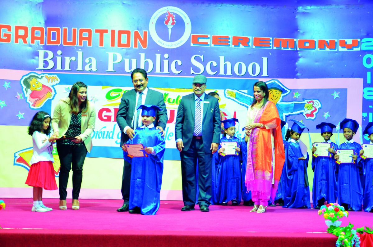 The students with school officials during the Kindergarten Graduation Day Ceremony.