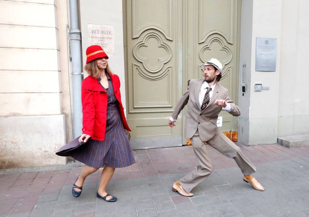 People attend the Silly Walk Parade, emulating a sketch from British comedy group Monty Python's television series to mark April Fool's day in Budapest, Hungary, April 1, 2019. Reuters/Bernadett Szabo
 