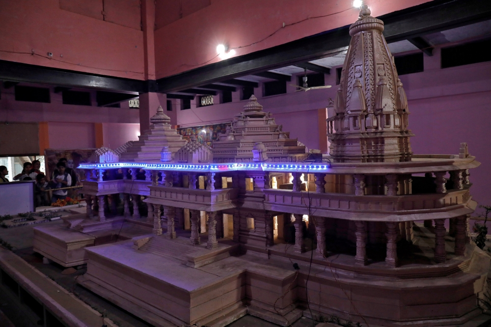 People look at a model of a proposed Ram temple that Hindu groups want to build at a disputed religious site in Ayodhya in the northern state of Uttar Pradesh, India, November 9, 2018. Reuters/Pawan Kumar