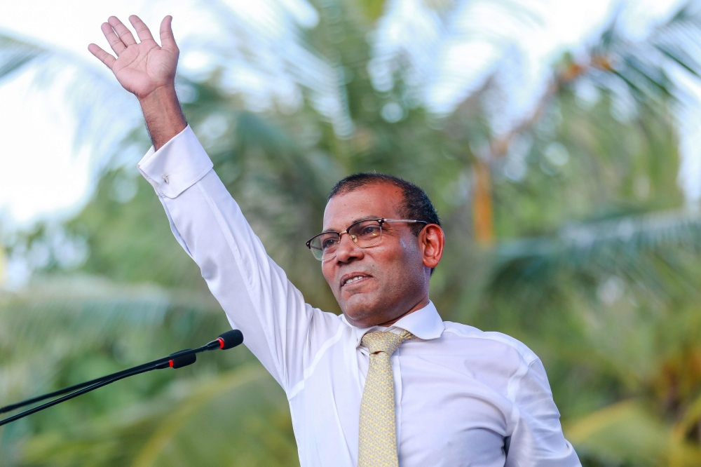 FILE PHOTO:  Former president of the Maldives Mohamed Nasheed waves as he addresses the country after returning from exile to the Maldives, in Male.  AFP / Ahmed SHURAU
