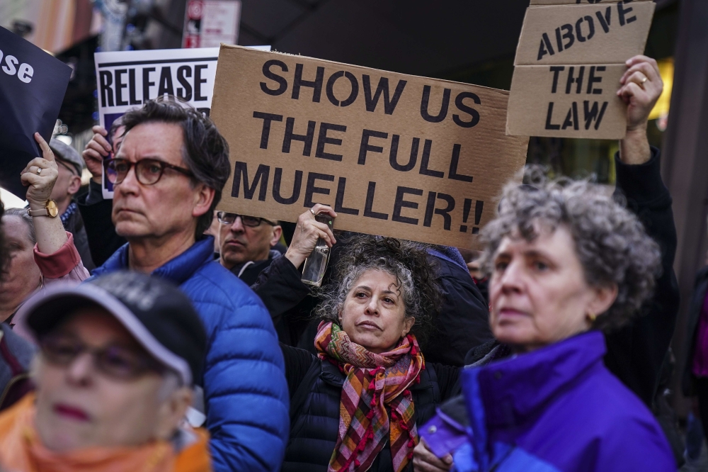 Activists participate in a 'Release the Report' rally in Times Square, April 4, 2019 in New York City. Drew Angerer/Getty Images/AFP mages/AFP 