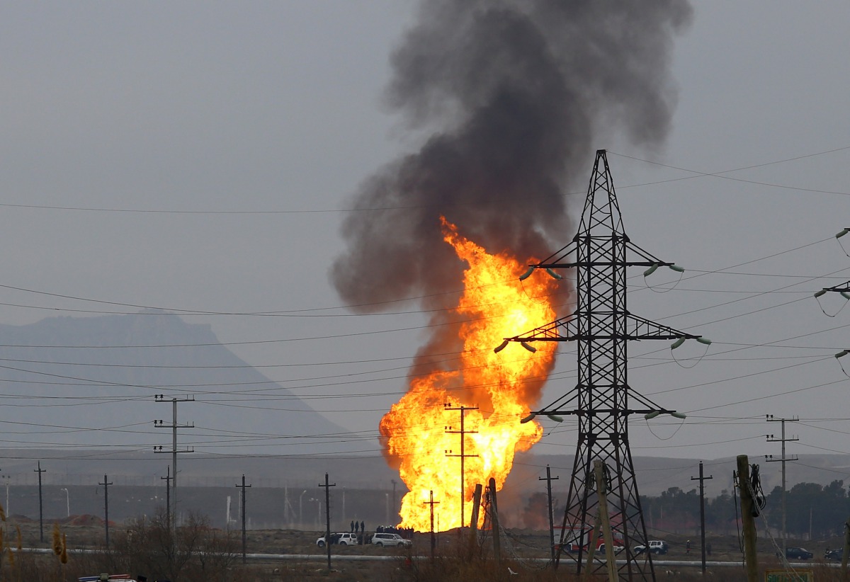 FILE PHOTO: Smoke and flames rise after an explosion at a gas pipeline in Sangachal town, 50 km from the capital of Azerbaijan, Baku, on December 27, 2016. Resul Rehimov/Anadolu Agency
