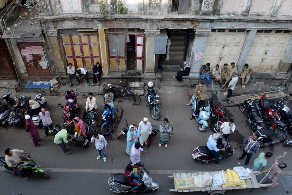 People walk through the Bhendi Bazaar area of Mumbai on December 2, 2016. AFP/Indranil Mukherjee