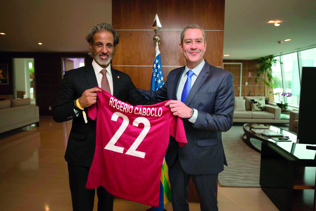 Qatar Football Association (QFA) President Sheikh Hamad bin Khalifa bin Ahmed Al Thani handing over a Qatar football jersey to the newly elected Brazil Football Association (CBF) President, Rogerio Caboclo during a meeting held in Rio de Janeiro, yesterda