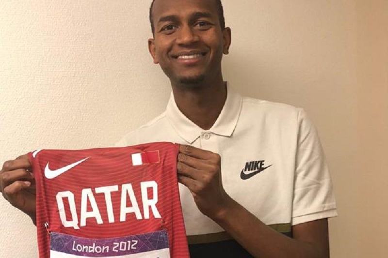 Qatar’s reigning world high jump champion, Mutaz Essa Barshim, holding  his London 2012 Olympic Games competition vest.