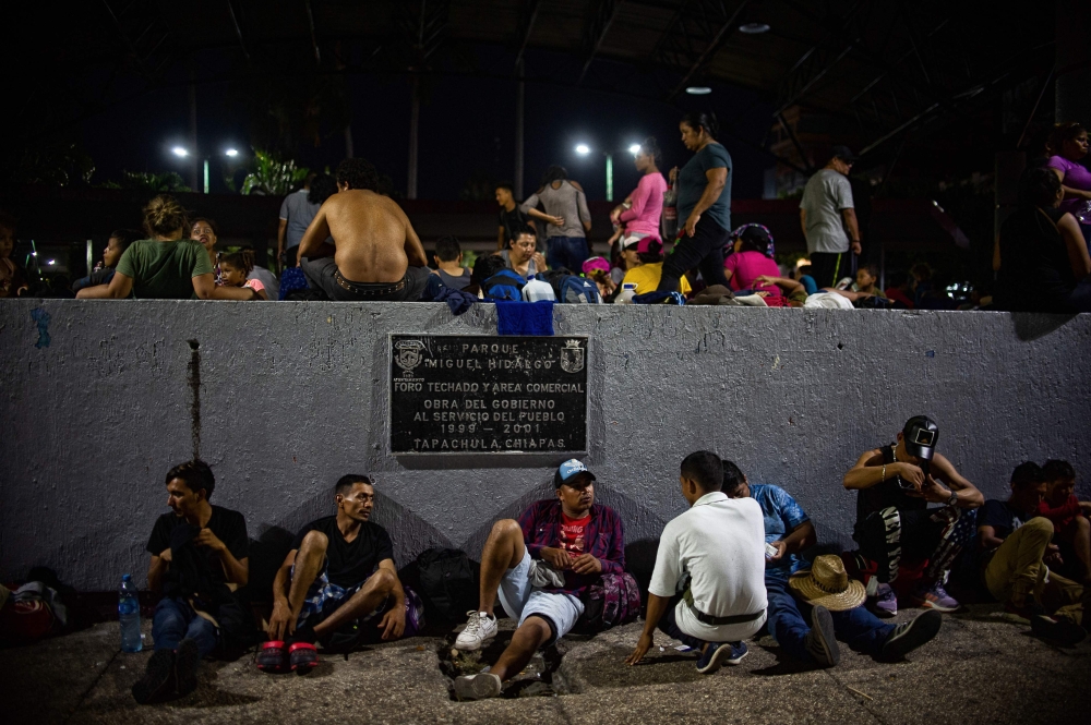 Central American migrants heading in caravan to the US rest at the park Hidalgo in Tapachula in Mexico on April 12, 2019.   AFP / PEP COMPANYS