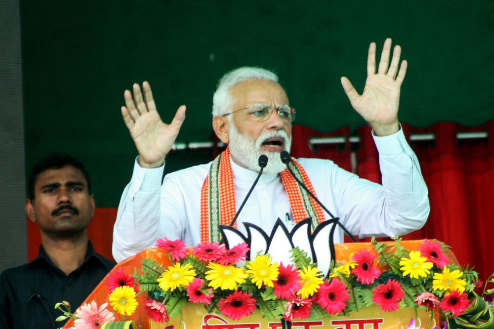 Indian Prime Minister Narendra Modi gestures while speaking at an election rally during the first phase of the Indian general elections in Bhagalpur, in the Indian state of Bihar on April 11, 2019.   AFP / Sachin KUMAR
