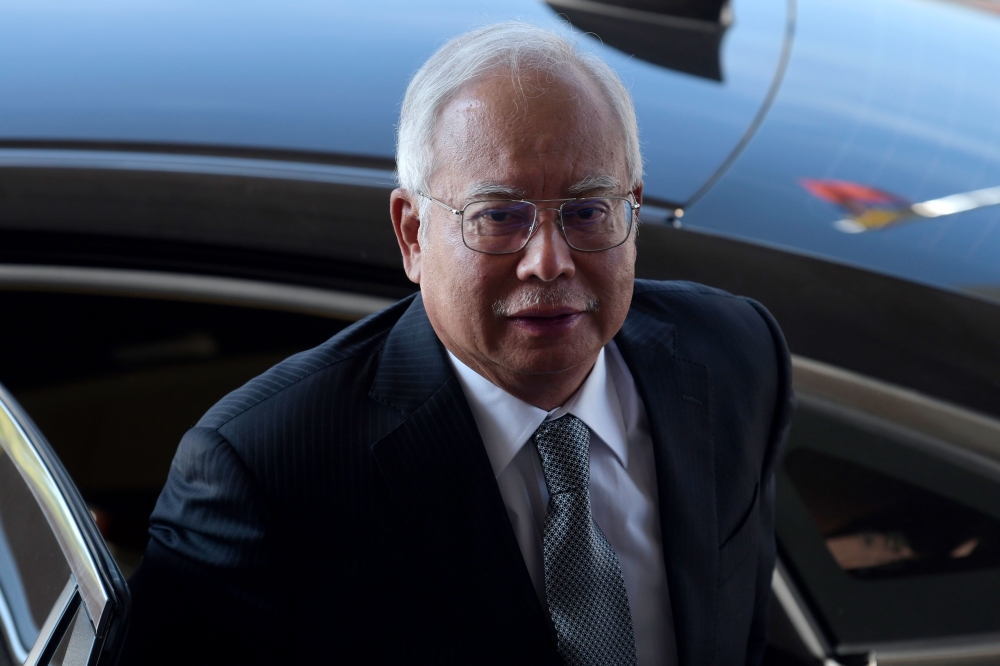 Malaysia's former prime minister Najib Razak arrives at the Kuala Lumpur High Court for his trial over 1MDB corruption allegations in Kuala Lumpur on April 15, 2019. Malaysia OUT / AFP / STR 
