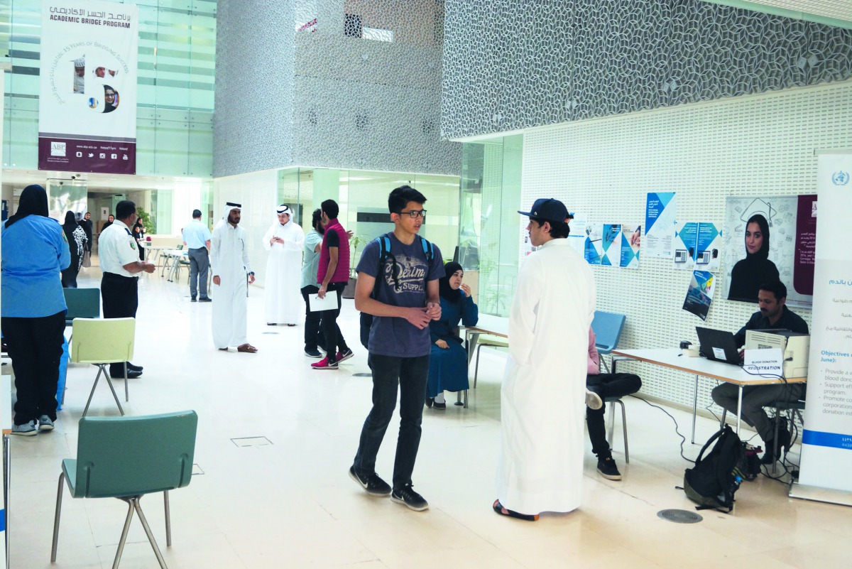 A student is being guided by volunteers at the health awareness fair organised  by ABP. 