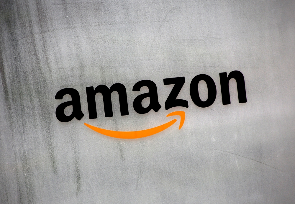 FILE PHOTO: Amazon.com's logo is seen at Amazon Japan's office building in Tokyo, Japan, August 8, 2016. REUTERS/Kim Kyung-Hoon