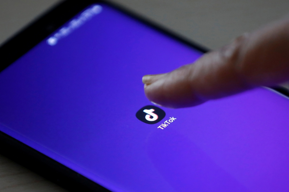 FILE PHOTO: The logo of the TikTok application is seen on a mobile phone screen in this picture illustration taken February 21, 2019. REUTERS/Danish Siddiqui/File Photo