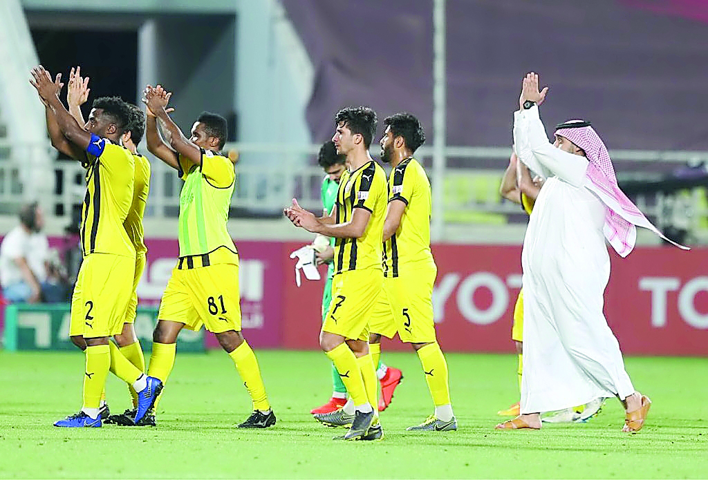  The players of Qatar SC celebrate their win.