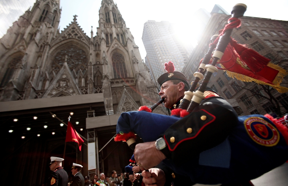 FILE PHOTO: A marching band passes St. Patrick's Cathedral during the annual St. Patrick's Day parade in New York, March 17, 2012. REUTERS/Carlo Allegri/File Photo