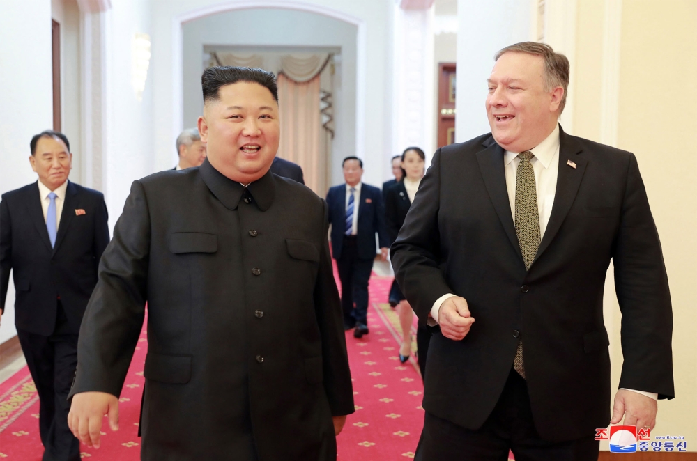 FILE PHOTO: North Korea's leader Kim Jong Un (L) greeting US Secretary of State Mike Pompeo (R) at the Paekhwawon State Guesthouse in Pyongyang.  AFP / KCNA VIA KNS