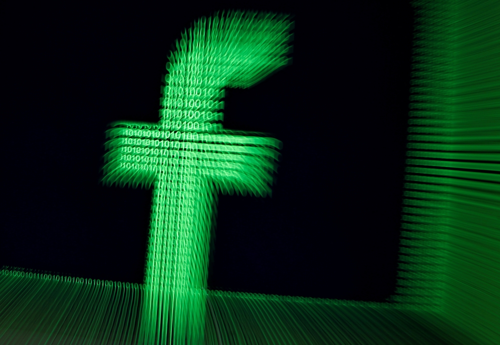 FILE PHOTO: A 3D-printed Facebook logo are seen in front of displayed binary digits in this illustration taken, March 18, 2018. REUTERS/Dado Ruvic/Illustration