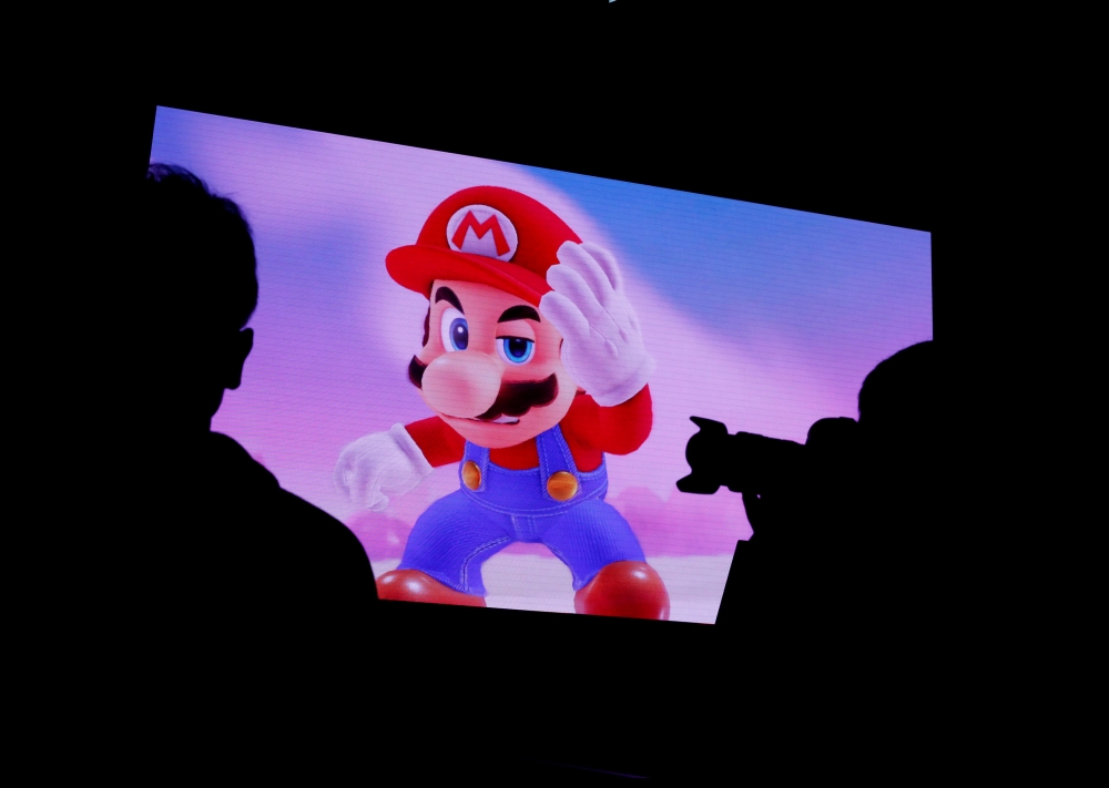 FILE PHOTO: Nintendo's game character Super Mario is seen on a screen at the presentation ceremony of Nintendo's new game console Switch in Tokyo, Japan January 13, 2017. REUTERS/Kim Kyung-Hoon