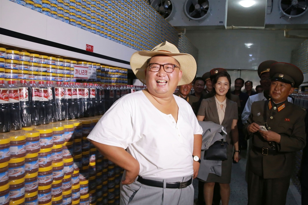 North Korean leader Kim Jong Un inspecting the Kumsanpho Fish Pickling Factory with his wife Ri Sol Ju in South Hwanghae Province, North Korea. (Picture by KCNA on August 8, 2018 via KNS) 