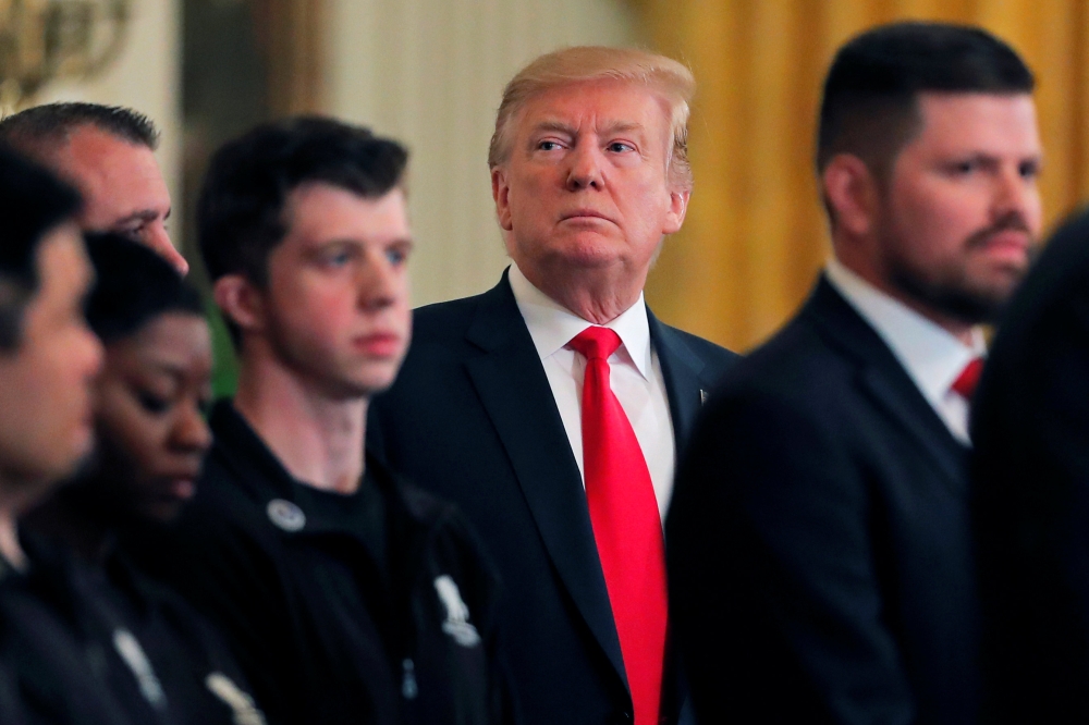 US President Donald Trump hosts participants of the Wounded Warrior Project Soldier Ride, after the release of Special Counsel Robert Mueller's report, in the East Room of the White House in Washington, US, April 18, 2019. Reuters/Lucas Jackson
 
