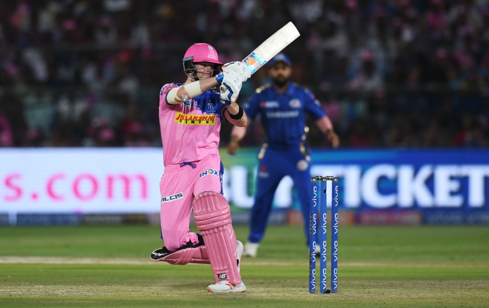 Rajasthan Royals batsman Steve Smith (R) plays a shot during the 2019 Indian Premier League (IPL) Twenty20 cricket match between Rajasthan Royals and Mumbai Indians at the Sawai Mansingh Stadium in Jaipur on April 20, 2019. (AFP / Money SHARMA)