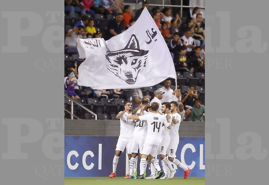 Al Sadd players celebrate after skipper Xavi Hernandez scored their opening goal against Uzbekistan’s Pakhtakor during their AFC Champions League Group D match played at the Al Sadd Stadium, yesterday. 