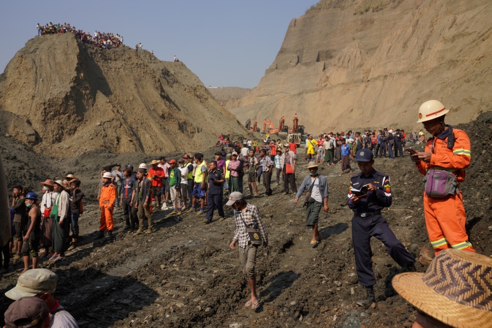 Local people look on in a jade mine where the mud dam collapsed in Hpakant, Kachin state, Myanmar April 23, 2019. Reuters