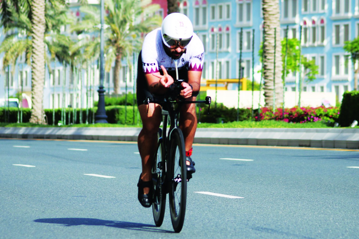 An athlete takes part in the Qatar National Triathlon Series at The Pearl-Qatar.
