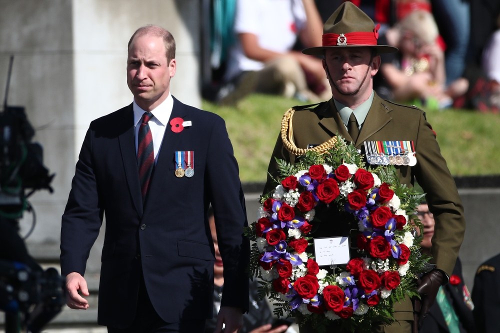 Britain's Prince William proceeds to lay a wreath during the Anzac Day service at Auckland War Memorial Museum on April 25, 2019.  / AFP / Fiona Goodall 