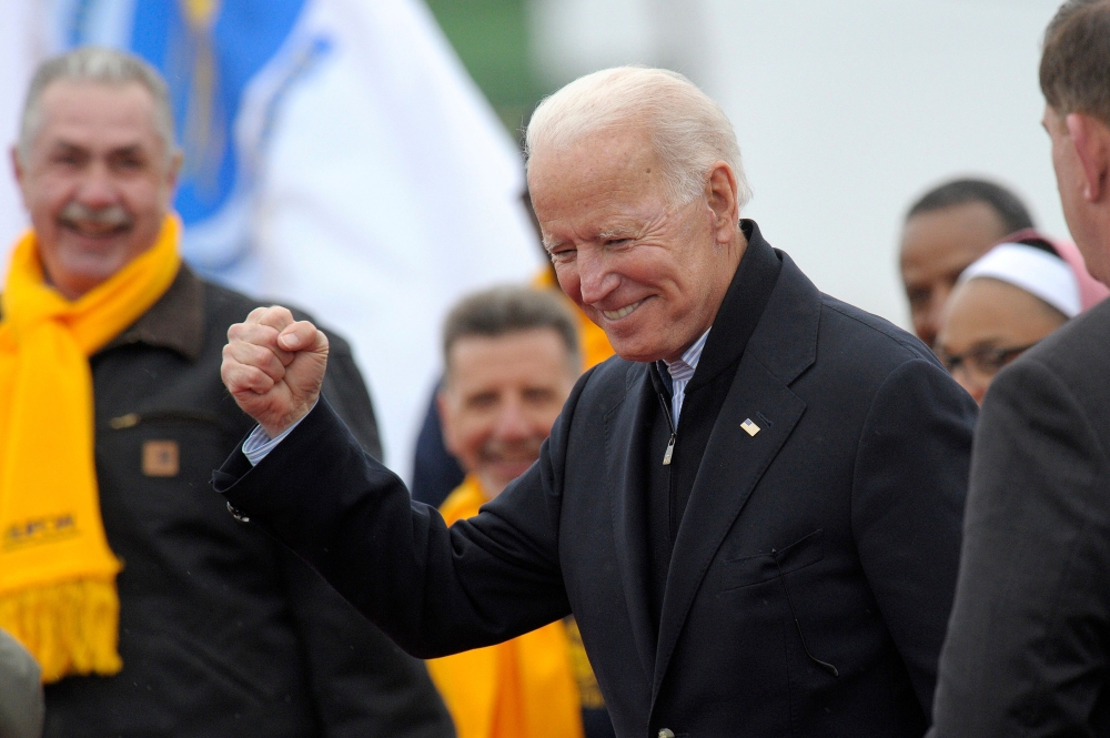 In this file photo taken on April 18, 2019 Former US vice president Joe Biden leaves a rally organized by UFCW Union members to support Stop and Shop employees on strike throughout the region at the Stop and Shop in Dorchester, Massachusetts.  / AFP / JOS