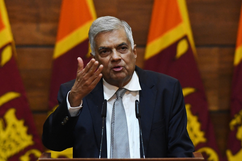Prime Minister of Sri Lanka Ranil Wickremesinghe gestures as he answers questions from a journalist during a press conference in Colombo on April 23, 2019. AFP/Mohd Rasfan 